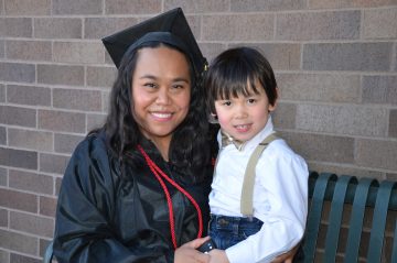 WTC graduate smiling with her son