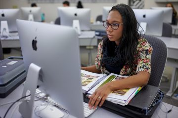 Graphic Design WCTC student in a computer lab.