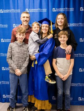 SWTC Graduate who is a mother of four pictured with her family following commencement